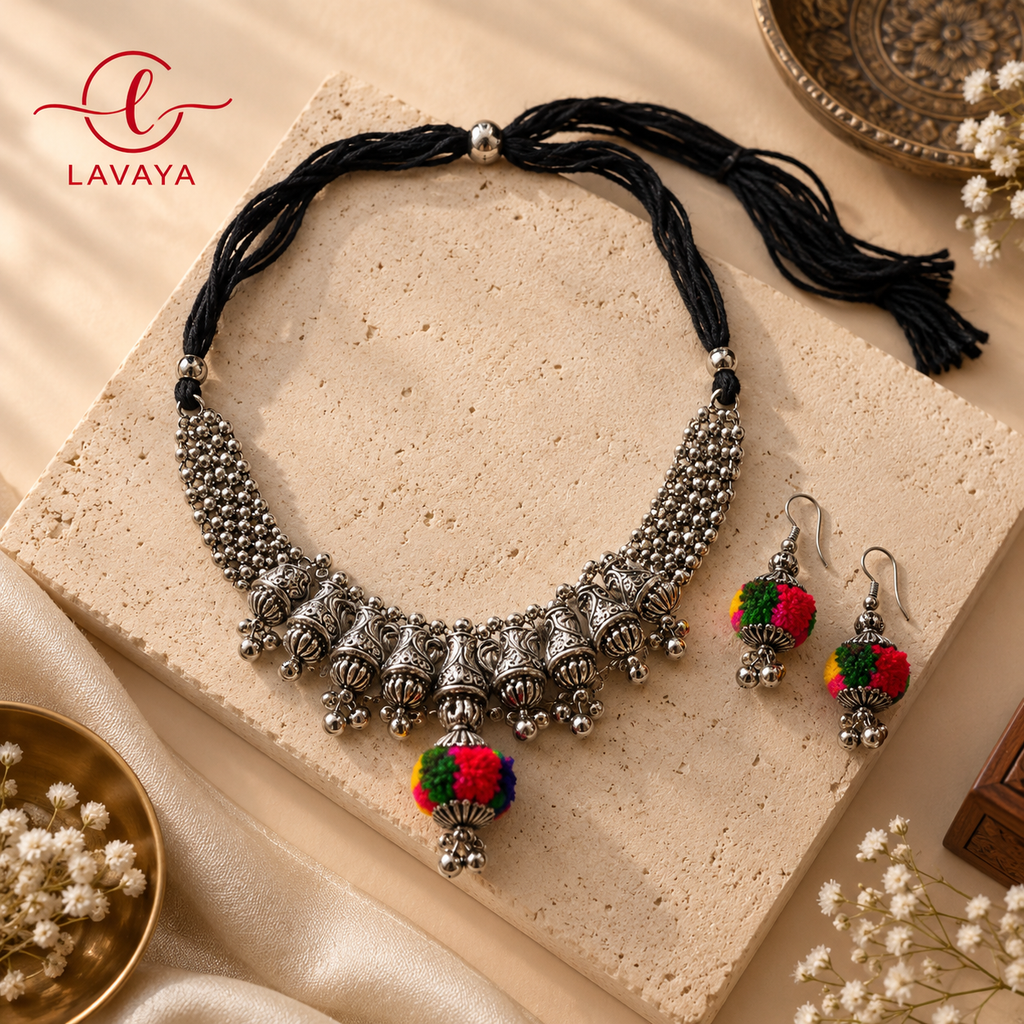 Lavaya The Phool-Pattika: Handcrafted Oxidized Silver Tribal Chevron Collar Necklace with Festive Pom-Pom Drop & Matching Earrings