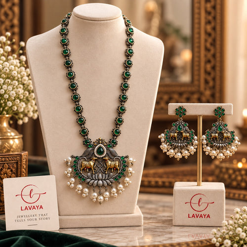 Dual-Tone Kamadhenu Cow Motif Long Haram Set with Emerald Green Stones & Pearl Bunches