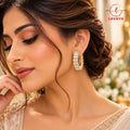 Baguette Eternity Sparkle: Chunky Baguette Cut Cubic Zirconia Huggie Hoop Earrings in Warm Gold Setting for Women